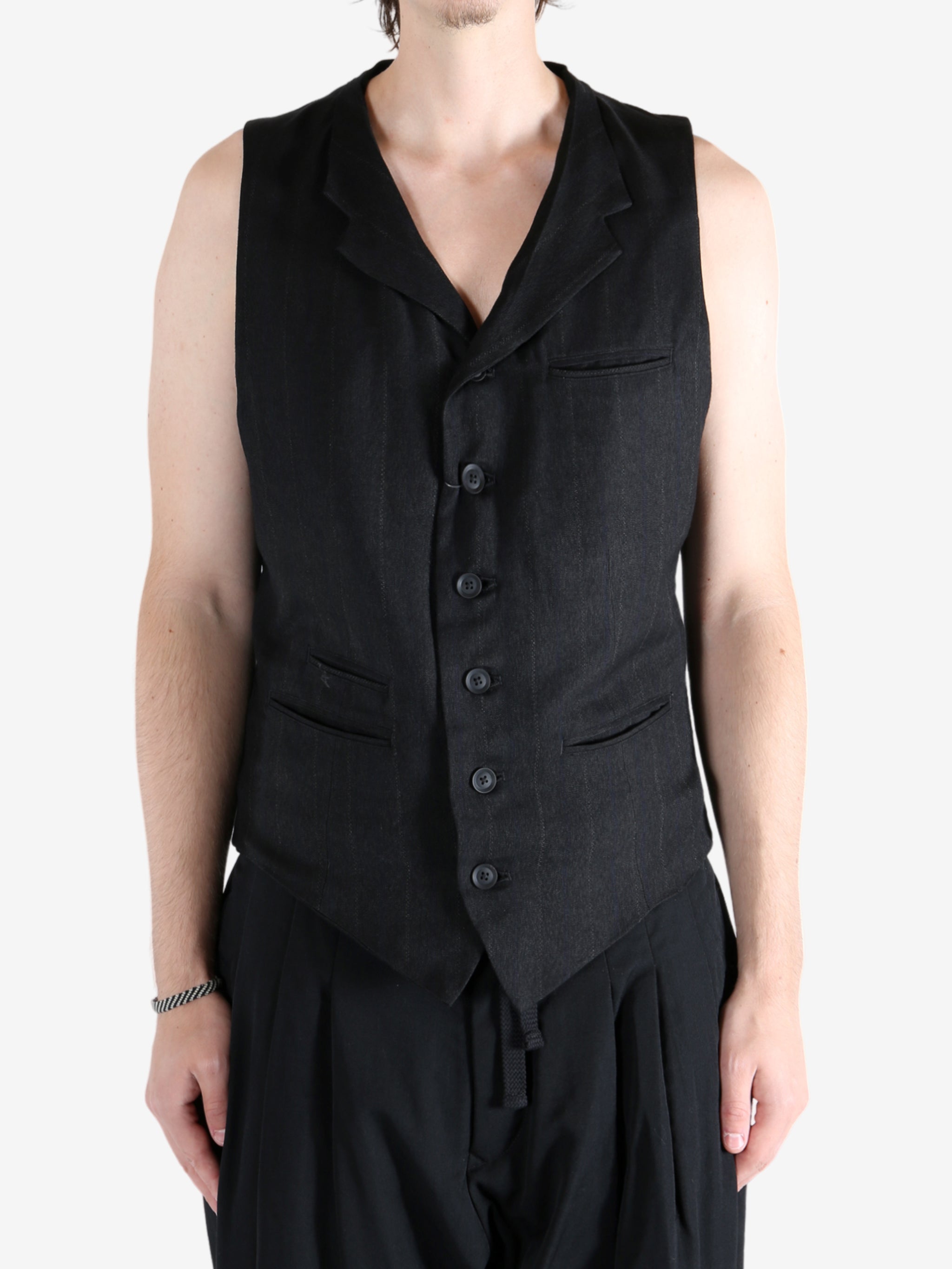 Black vest worn by a person, showing the vest fit