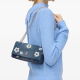 Blue bag worn by a person, showing the bag fit