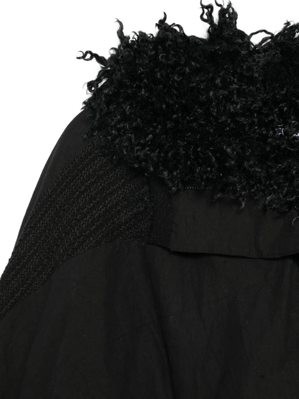 Close up of Black jacket, showing texture of the 50% cotton/ 50% polyester fabric