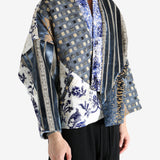 Blue coat worn by a person, showing the coat fit