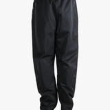 Black pants worn by a person, showing the pants's fit