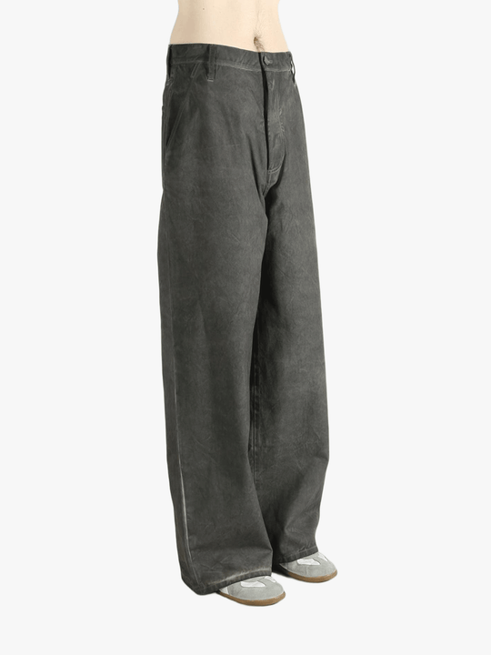 Grey pants worn by a person, showing the pants' fit