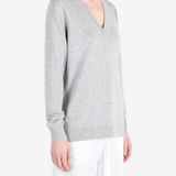 Grey hoodie worn by a person, showing the hoodie fit
