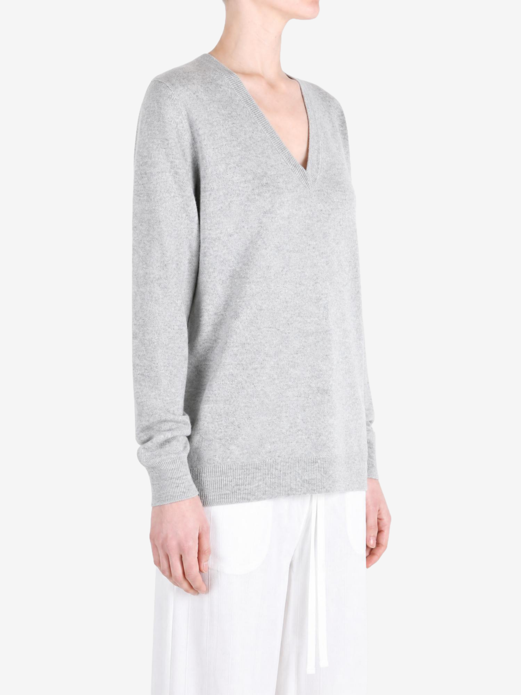 Grey hoodie worn by a person, showing the hoodie fit