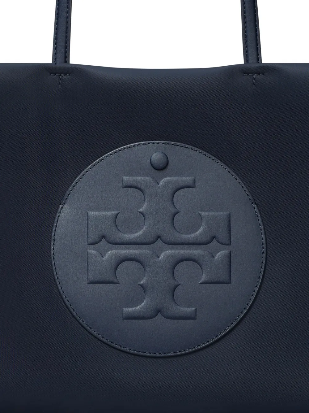 Close up of navy bags, showing texture of the recycled polyester and recycled nylon fabric