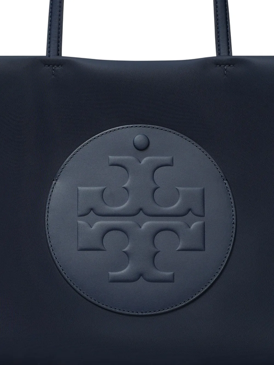 Close up of navy bags, showing texture of the recycled polyester and recycled nylon fabric