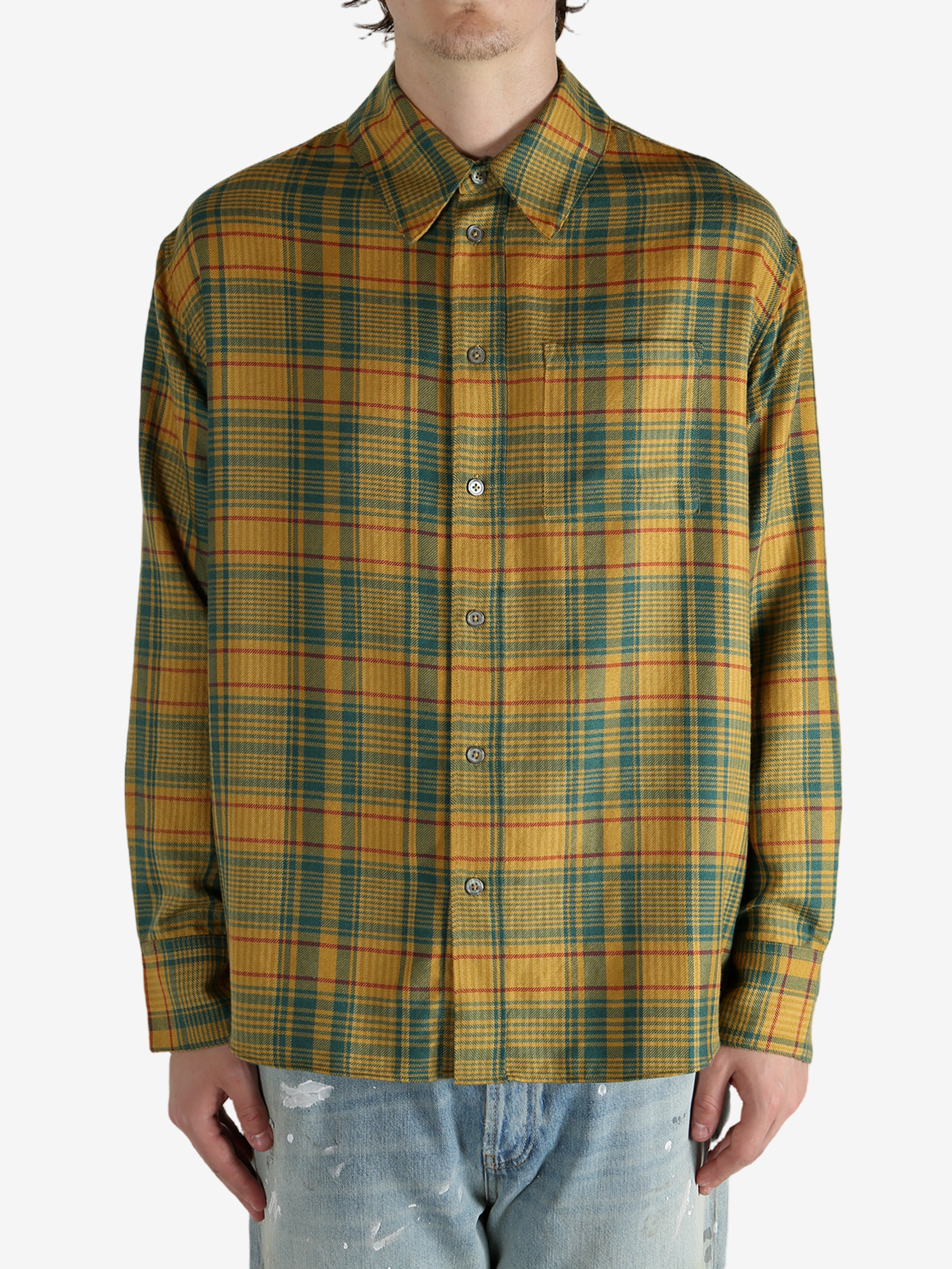 Yellow shirt worn by a person, showing the shirt’s fit