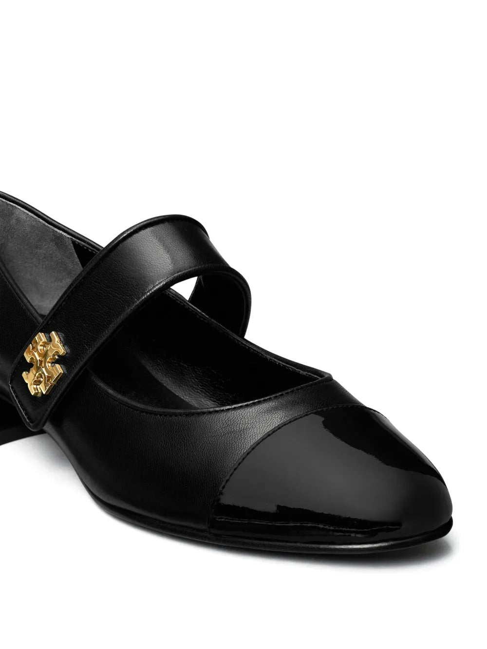 Cloes-up of black shoe, showing texture of the leather fabric