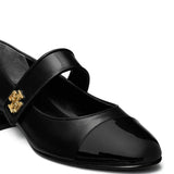 Cloes-up of black shoe, showing texture of the leather fabric
