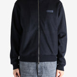 Navy coat worn by a person, showing the coat's fit