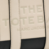 Close up of tan bags, showing texture of the cow leather fabric