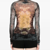 Black top worn by a person, showing the top fit