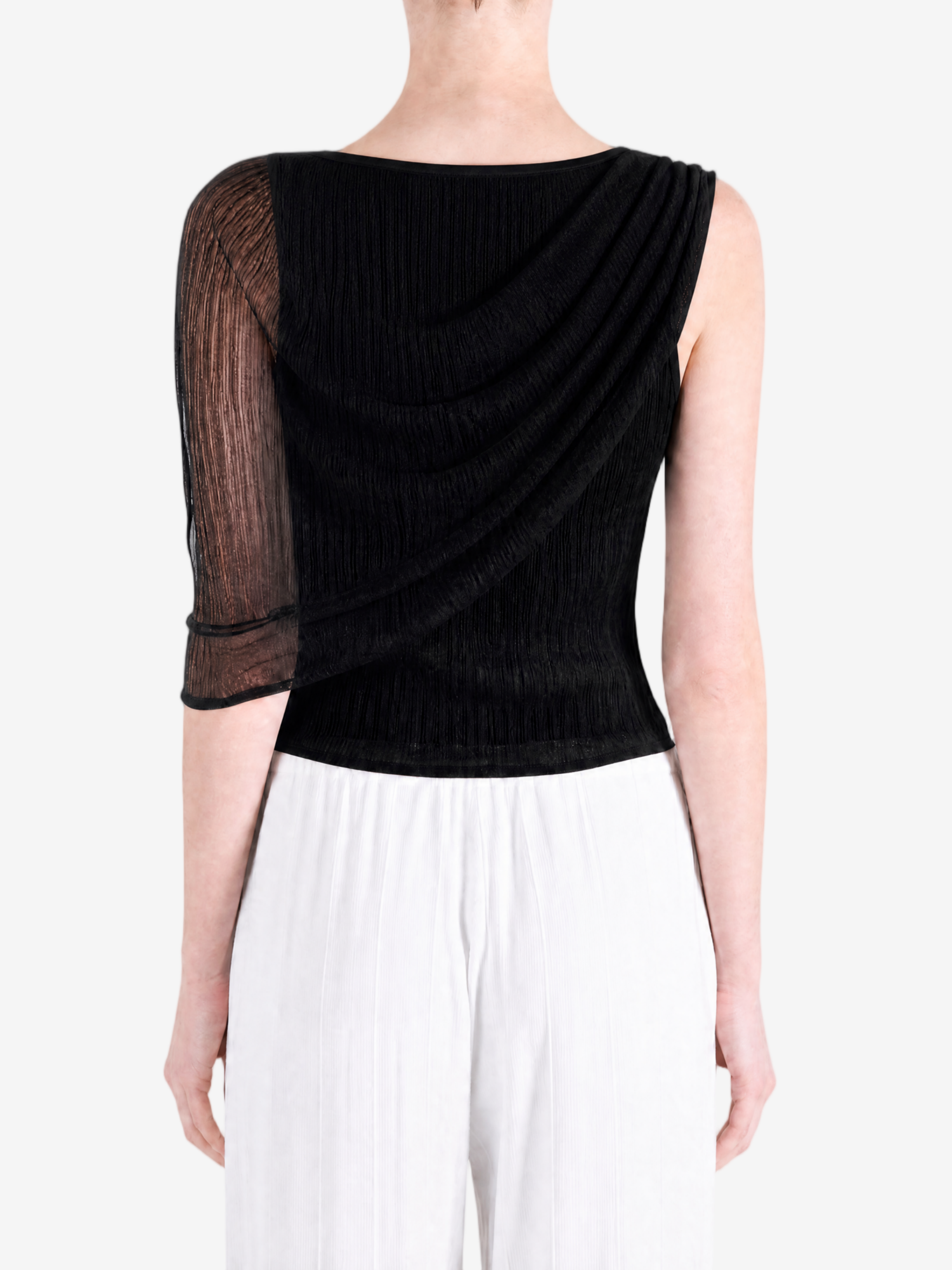 Black top worn by a person, showing the top fit