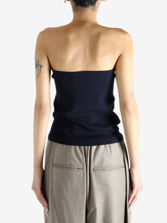 Navy top worn by a person, showing the top's fit