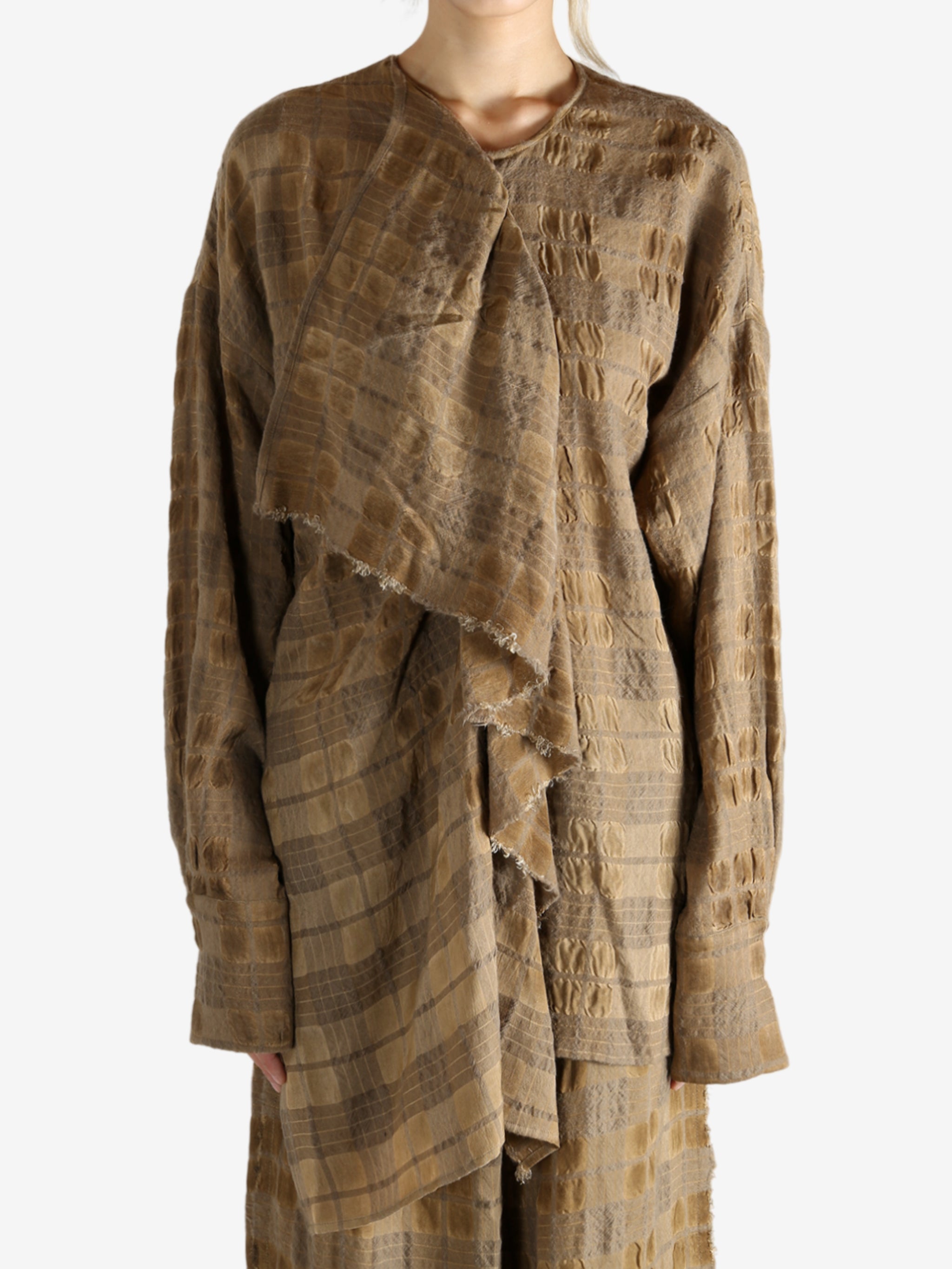 Brown top worn by a person, showing the top fit