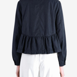 Navy jacket worn by a person, showing the jacket fit
