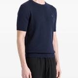 Blue hoodie worn by a person, showing the hoodie fit