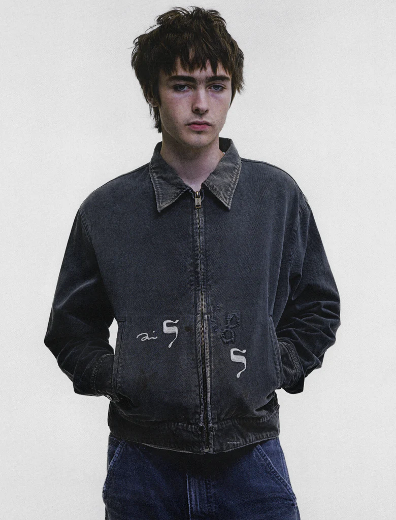 Black jacket worn by a person, showing the jacket fit
