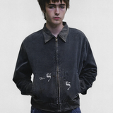 Black jacket worn by a person, showing the jacket fit