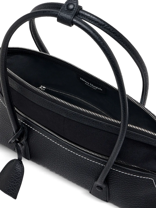 Close up of black bag, showing texture of the Calf Leather fabric