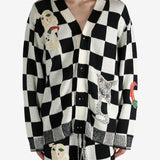 Black cardigan worn by a person, showing the cardigan’s fit