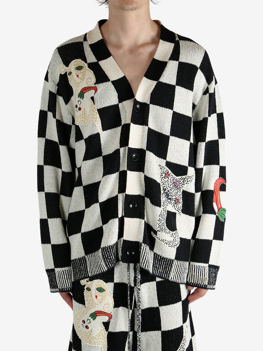 Black cardigan worn by a person, showing the cardigan’s fit