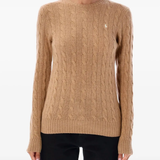 Brown knitwear worn by a person, showing the knitwear's fit