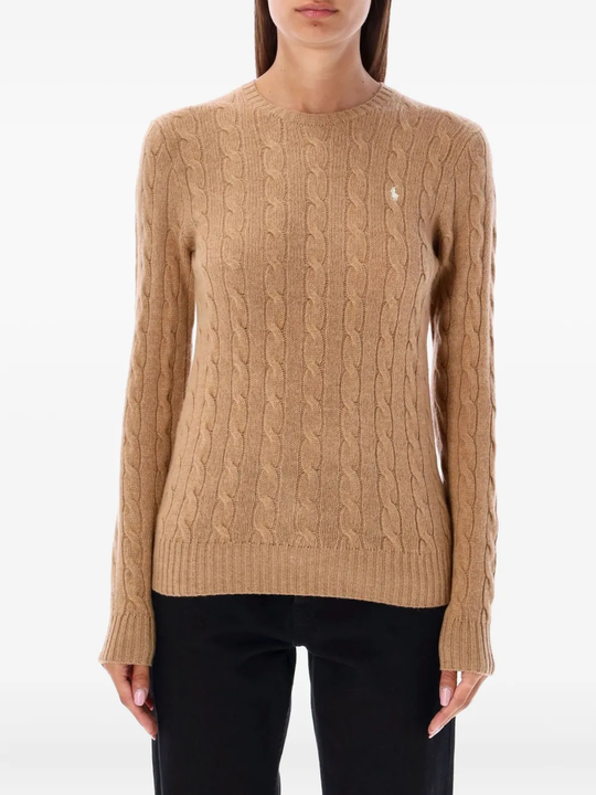 Brown knitwear worn by a person, showing the knitwear's fit