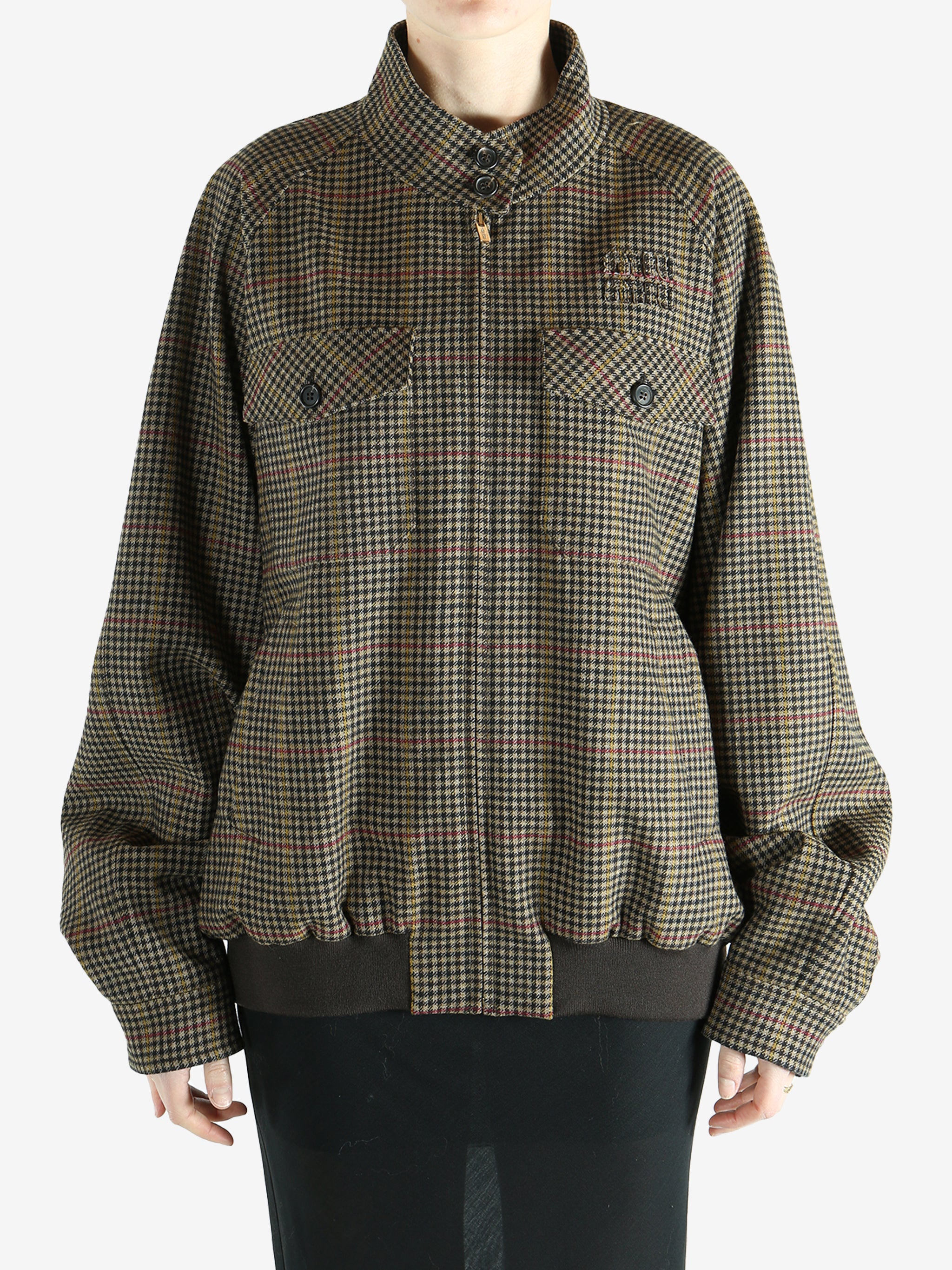 Brown jacket worn by a person, showing the jacket's fit