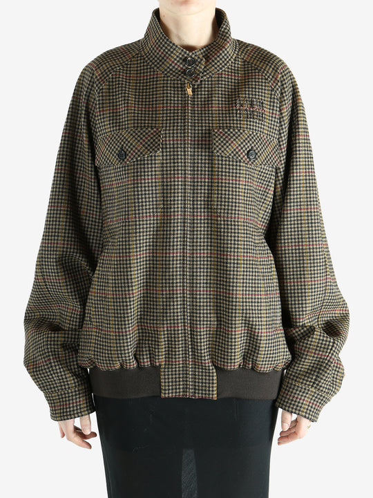 Brown jacket worn by a person, showing the jacket's fit