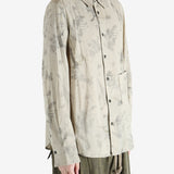 green shirts worn by a person, showing the shirts  fit