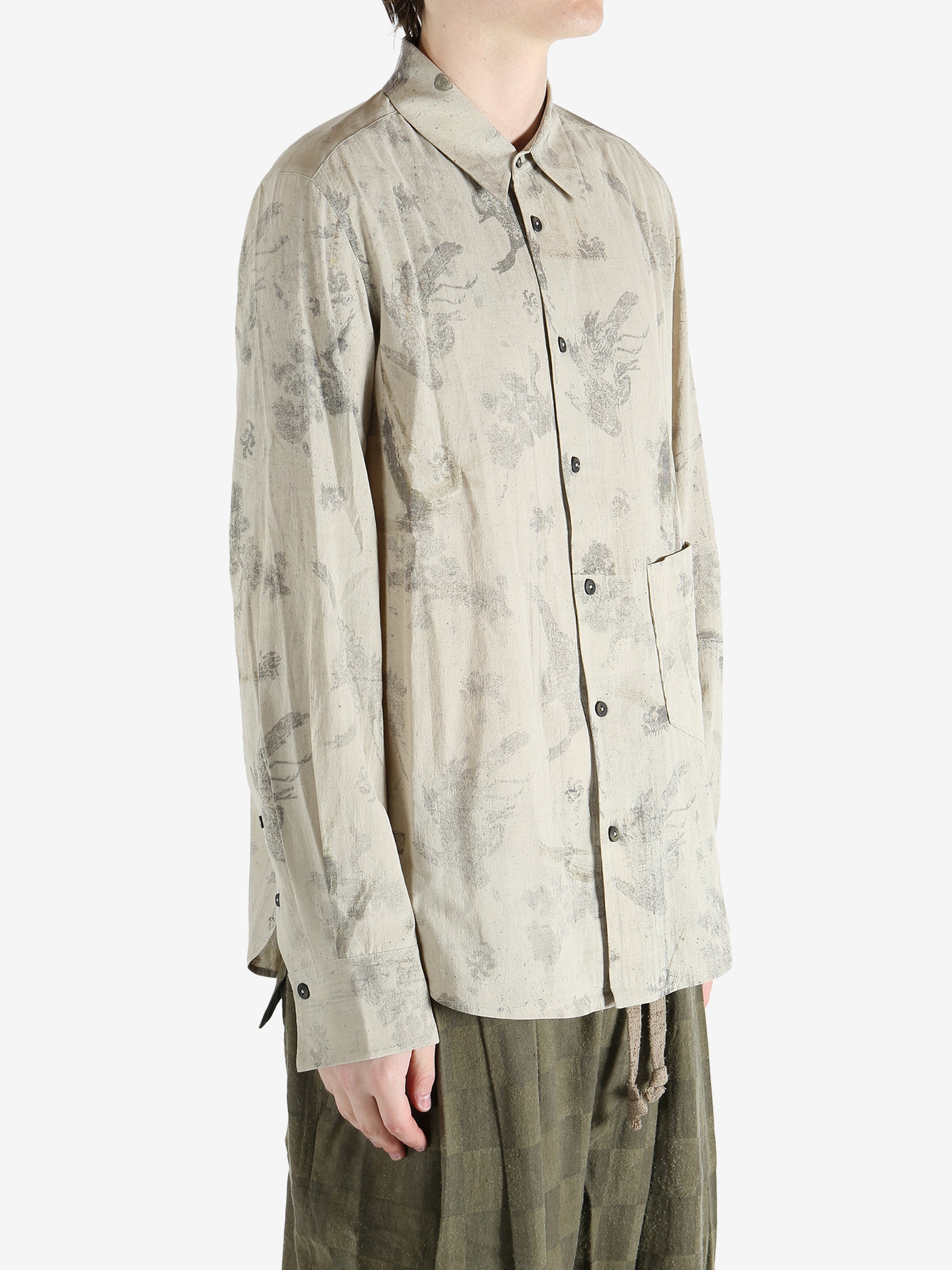 green shirts worn by a person, showing the shirts  fit