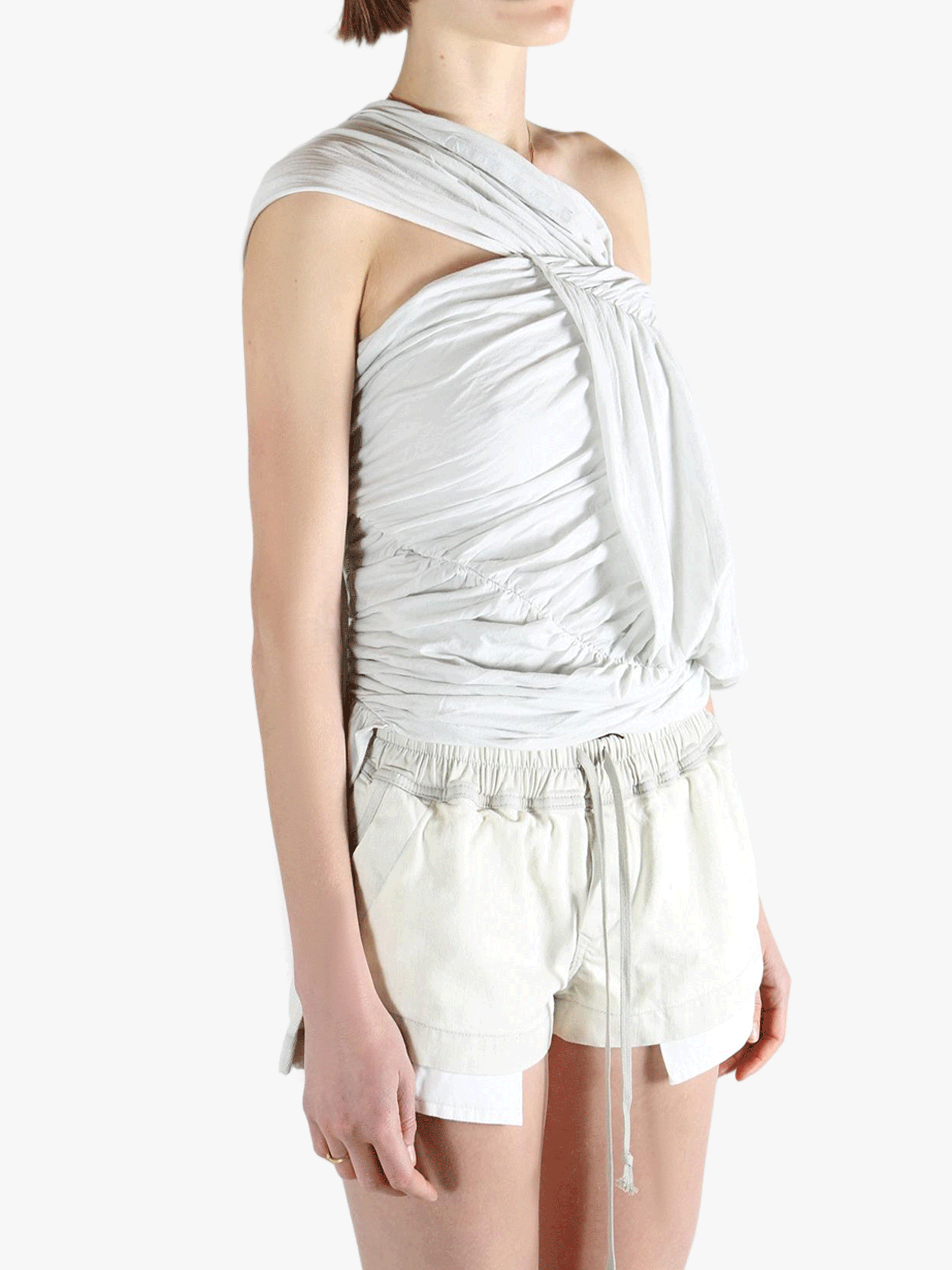 White tops worn by a person, showing the tops fit