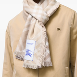 Brown scarf worn by a person, showing the scarf fit