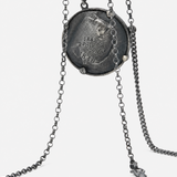 Close up of Grey jewelry, showing detail