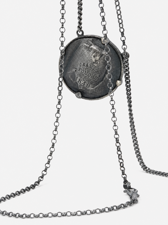 Close up of Grey jewelry, showing detail