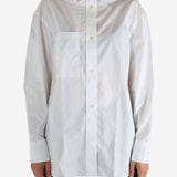 White shirt worn by a person, showing the shirt's fit