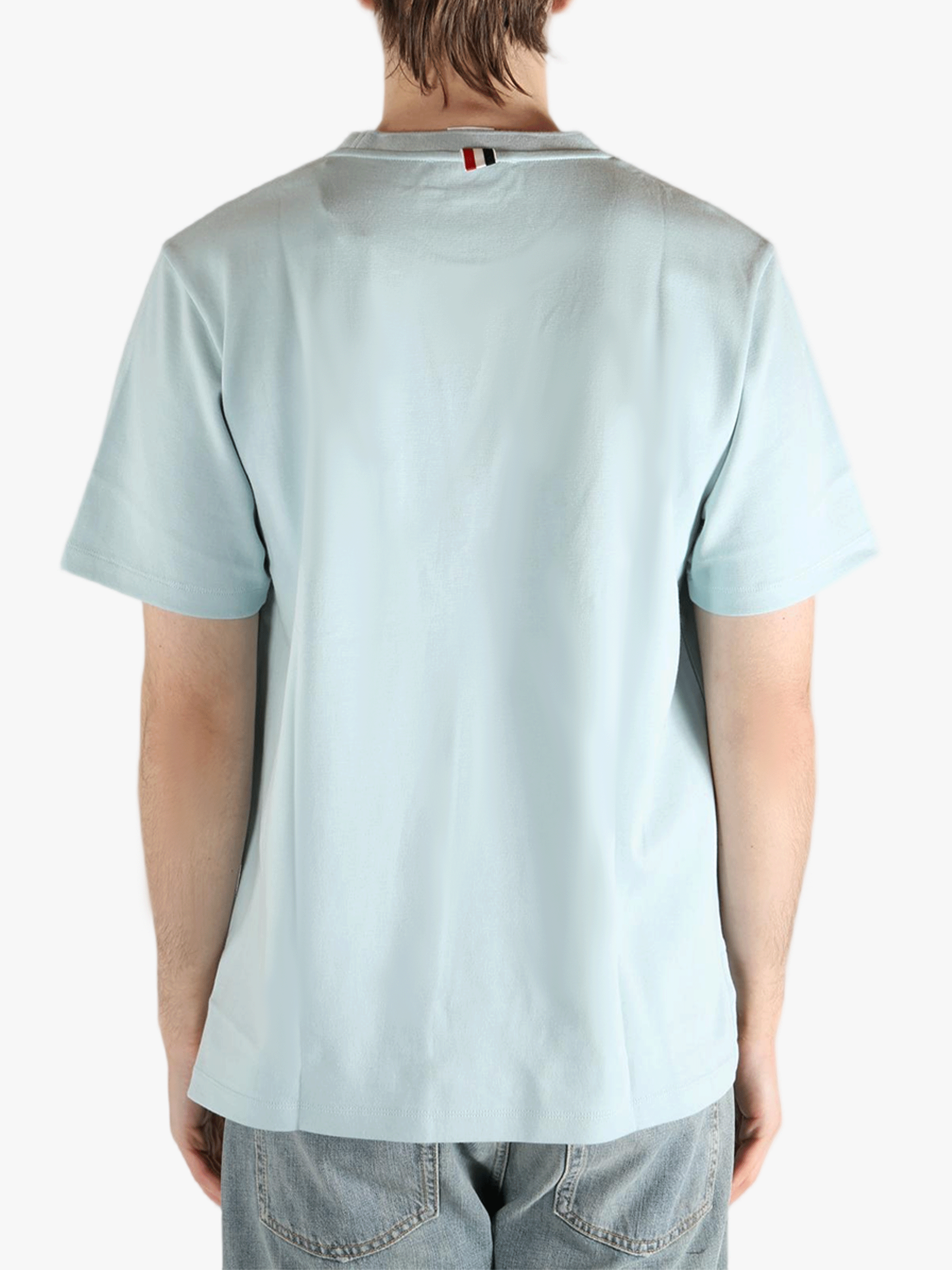 Blue t-shirt worn by a person, showing the t-shirt fit