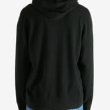 Black hoodie worn by a person, showing the hoodie's fit