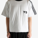 White t-shirt worn by a person, showing the shirt's fit