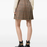 Tan skirt worn by a person, showing the skirt fit