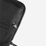 Close up of the brown pant, showing texture of the nylon fabric