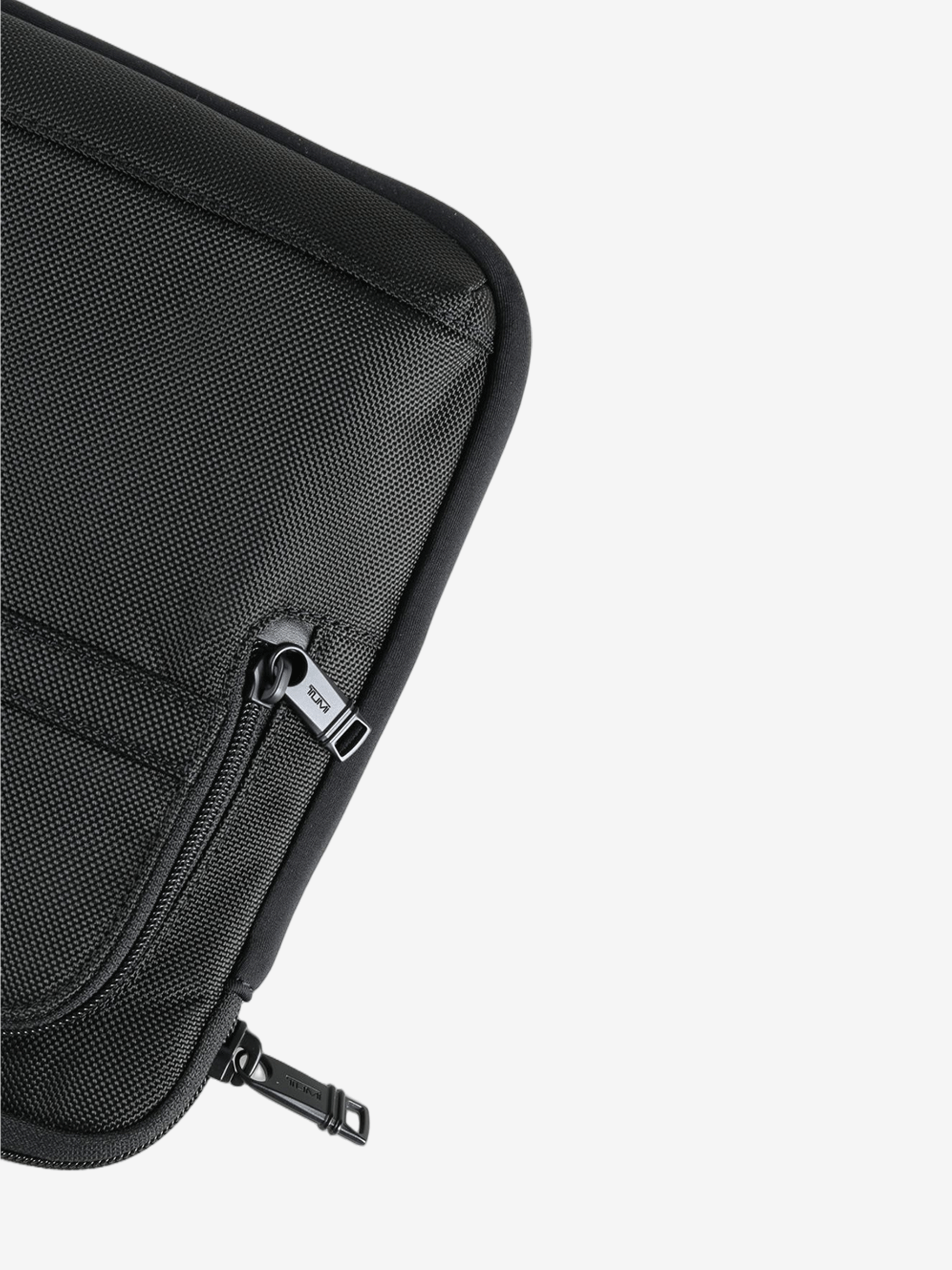 Close up of the brown pant, showing texture of the nylon fabric