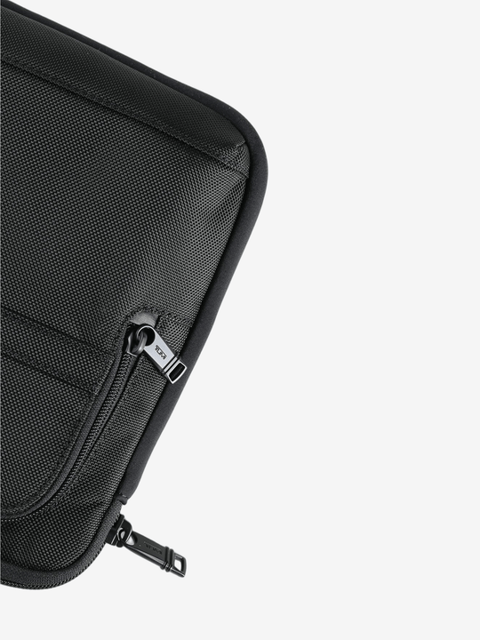 Close up of the brown pant, showing texture of the nylon fabric