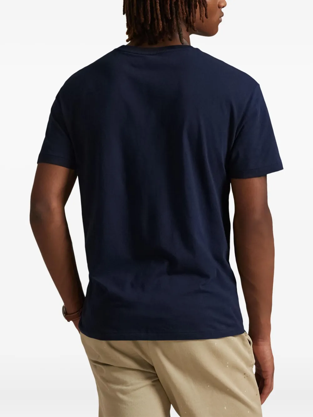 Blue t-shirts worn by a person, showing the t-shirts fit