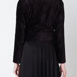 Black jacket worn by a person, showing the jacket's fit