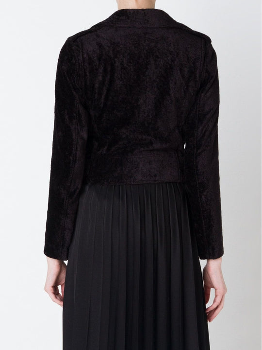 Black jacket worn by a person, showing the jacket's fit