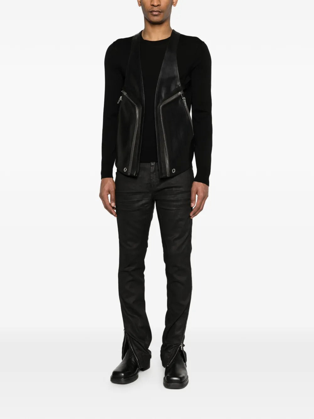 Black vest worn by a person, showing the vest's fit