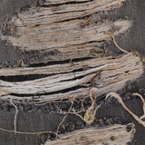 Close up of the balck jeans, showing texture of the cotton fabric