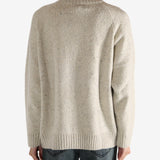 White knitwear worn by a person,showing the knitwear's fit